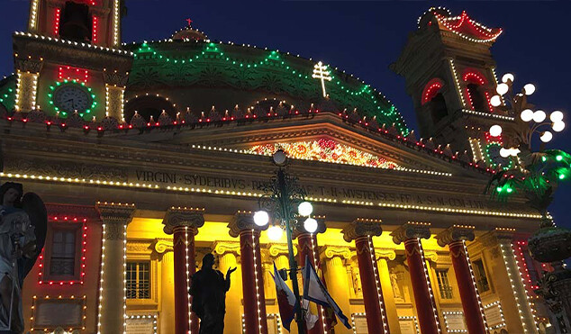 Exterior of church decorated for the feast of Santa Marija