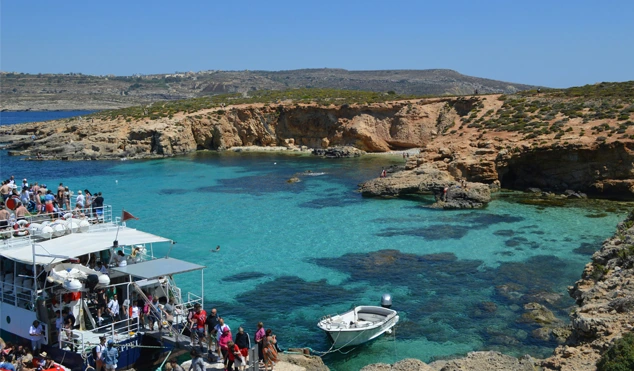 People arriving on Comino by boat