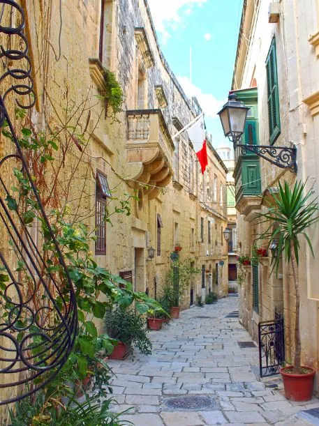 The charming streets of Birgu lined with traditional Maltese townhouses